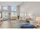 Inviting living room with comfortable seating, high ceilings, and lots of natural light at 800 9Th Ave. S # N-1, North Myrtle Beach, SC 29582