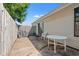 Private patio with table is enclosed by a wooden fence at 800 9Th Ave. S # N-1, North Myrtle Beach, SC 29582