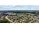 High-angle view of a well-maintained residential community with serene ponds, lush landscaping, and nearby commercial areas at 807 Wilshire Ln. # 807, Murrells Inlet, SC 29576