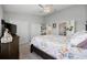 Bright bedroom featuring floral bedding, ceiling fan, and closet space at 807 Wilshire Ln. # 807, Murrells Inlet, SC 29576