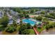 Beautiful aerial view of a community pool, well-manicured landscaping, and charming pedestrian bridge in a residential area at 807 Wilshire Ln. # 807, Murrells Inlet, SC 29576