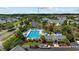 Overhead view of a sparkling community pool with ample lounge space, surrounded by lush landscaping and residential homes at 807 Wilshire Ln. # 807, Murrells Inlet, SC 29576