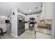 Well-appointed kitchen with stainless steel appliances, white cabinetry, and granite counters at 807 Wilshire Ln. # 807, Murrells Inlet, SC 29576