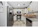 Charming kitchen featuring white cabinets, stainless steel appliances, and granite countertops at 807 Wilshire Ln. # 807, Murrells Inlet, SC 29576