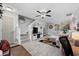 Open living room features staircase, tile flooring, neutral paint, a ceiling fan, and comfortable seating at 807 Wilshire Ln. # 807, Murrells Inlet, SC 29576