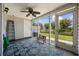 Cozy screened-in porch with comfortable seating, a ceiling fan, and scenic views at 807 Wilshire Ln. # 807, Murrells Inlet, SC 29576