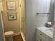 Modern bathroom features framed artwork, a glass-enclosed shower, and a white vanity with sink at 812 S Ocean Blvd. # B-3, Surfside Beach, SC 29575