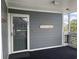 Exterior entrance to unit features 'Beach House' sign, door and a secure entryway at 812 S Ocean Blvd. # B-3, Surfside Beach, SC 29575