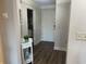 Bright foyer with hardwood floors, neutral walls and decorative console table and decor at 812 S Ocean Blvd. # B-3, Surfside Beach, SC 29575