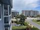Exterior shot of buildings and landscaping, offering partial ocean views at 812 S Ocean Blvd. # B-3, Surfside Beach, SC 29575