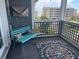 Relaxing patio with a bench, rug, and a view of the building and ocean at 812 S Ocean Blvd. # B-3, Surfside Beach, SC 29575