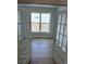 Inviting living room with wood floors and glass doors overlooking the property at 901 Inlet Keys St., Murrells Inlet, SC 29576