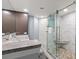 Shower with glass door, granite counter top, and pebble floor at 9650 Shore Dr. # 507, Myrtle Beach, SC 29572