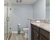 Well lit bathroom featuring granite countertops, a toilet and glass enclosed shower at 9650 Shore Dr. # 507, Myrtle Beach, SC 29572