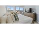 Bright bedroom with a large window and balcony offering city views at 9650 Shore Dr. # 507, Myrtle Beach, SC 29572