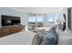 Relaxing bedroom boasting calming blue tones, a TV, and balcony access with ocean views at 9650 Shore Dr. # 507, Myrtle Beach, SC 29572