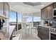 Bright kitchen featuring a breakfast bar and modern appliances with direct access to the balcony at 9650 Shore Dr. # 507, Myrtle Beach, SC 29572