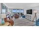 Bright living room with comfortable seating, ocean views, and a modern entertainment center at 9650 Shore Dr. # 507, Myrtle Beach, SC 29572