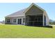 Backyard view of home with a screened porch, patio, and manicured lawn at Tbd 222 Persimmon Rd., Aynor, SC 29511