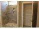 Bathroom showcasing a tiled shower with a built-in niche and a linen closet at Tbd 222 Persimmon Rd., Aynor, SC 29511