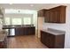 Spacious kitchen with stainless steel appliances and granite countertops, open to the living area at Tbd 222 Persimmon Rd., Aynor, SC 29511