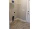 The laundry room features tile flooring and a wire shelf above the washer hookups at Tbd 222 Persimmon Rd., Aynor, SC 29511