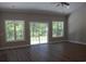 Spacious living room with vaulted ceilings, ceiling fan, and windows overlooking the backyard at Tbd 222 Persimmon Rd., Aynor, SC 29511