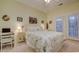 Bright bedroom featuring a queen bed, ensuite bathroom, and french doors at 1058 Sea Mountain Hwy. # 10-101, North Myrtle Beach, SC 29582