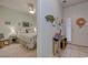 Comfortable bedroom with bedside table and lamp visible from hallway entrance at 1058 Sea Mountain Hwy. # 10-101, North Myrtle Beach, SC 29582
