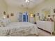Bright bedroom featuring a queen bed, ensuite bathroom, and french doors at 1058 Sea Mountain Hwy. # 10-101, North Myrtle Beach, SC 29582