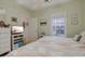 Well-lit bedroom boasts a window view and a TV, offering comfort and entertainment at 1058 Sea Mountain Hwy. # 10-101, North Myrtle Beach, SC 29582