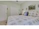 Bedroom with a floral-patterned bedspread, a door, and closet at 1058 Sea Mountain Hwy. # 10-101, North Myrtle Beach, SC 29582