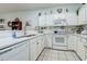 Bright kitchen featuring white cabinetry and essential appliances at 1058 Sea Mountain Hwy. # 10-101, North Myrtle Beach, SC 29582
