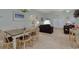 Open-concept living and dining area with carpeted floors and plenty of natural light at 1058 Sea Mountain Hwy. # 10-101, North Myrtle Beach, SC 29582