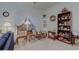 Bright living room with a rocking chair and bookshelf at 1058 Sea Mountain Hwy. # 10-101, North Myrtle Beach, SC 29582