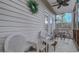 Spacious screened-in patio featuring tile floors and a dining set at 1058 Sea Mountain Hwy. # 10-101, North Myrtle Beach, SC 29582