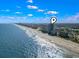 Aerial view of the coast with a pinpoint over a condominium on the beach at 107 S Ocean Blvd. # 503, Myrtle Beach, SC 29577