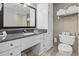 Hotel bathroom featuring granite countertops, modern cabinets, and essential toiletries provided at 107 S Ocean Blvd. # 503, Myrtle Beach, SC 29577