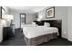 Hotel bedroom featuring two beds, abstract art, and a dresser near a door leading to the balcony at 107 S Ocean Blvd. # 503, Myrtle Beach, SC 29577