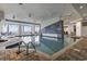 Beautiful indoor pool area with brick trim and floor-to-ceiling windows showing views of the ocean at 107 S Ocean Blvd. # 503, Myrtle Beach, SC 29577