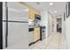 Efficient kitchen with appliances, cabinets, and tile flooring at 107 S Ocean Blvd. # 503, Myrtle Beach, SC 29577
