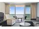 Inviting living room featuring comfortable seating and a sliding glass door to the beautiful ocean view balcony at 107 S Ocean Blvd. # 503, Myrtle Beach, SC 29577