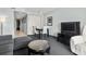 Living room and dining area with seating, TV, and striped carpet at 107 S Ocean Blvd. # 503, Myrtle Beach, SC 29577