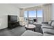 Cozy living room area with seating and a view of the ocean from the balcony at 107 S Ocean Blvd. # 503, Myrtle Beach, SC 29577