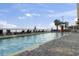Large outdoor pool area with lounge chairs and umbrellas, perfect for soaking up the sun and relaxing at 107 S Ocean Blvd. # 503, Myrtle Beach, SC 29577