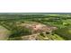 High aerial view of a developing residential area with new homes and surrounding greenery at 108 Forman Way, Aynor, SC 29511