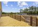 New wood deck, perfect for outdoor relaxation and entertaining, with a view of the expansive lot at 108 Forman Way, Aynor, SC 29511