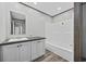Well-lit bathroom featuring a sleek vanity, modern fixtures, and a new bathtub-shower combo at 108 Forman Way, Aynor, SC 29511