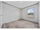 Bright bedroom with new flooring and trim, plus a view of the undeveloped new construction neighborhood at 108 Forman Way, Aynor, SC 29511
