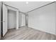 Bedroom showcasing wood-look floors, neutral walls, closet and doorway to another room in the house at 108 Forman Way, Aynor, SC 29511